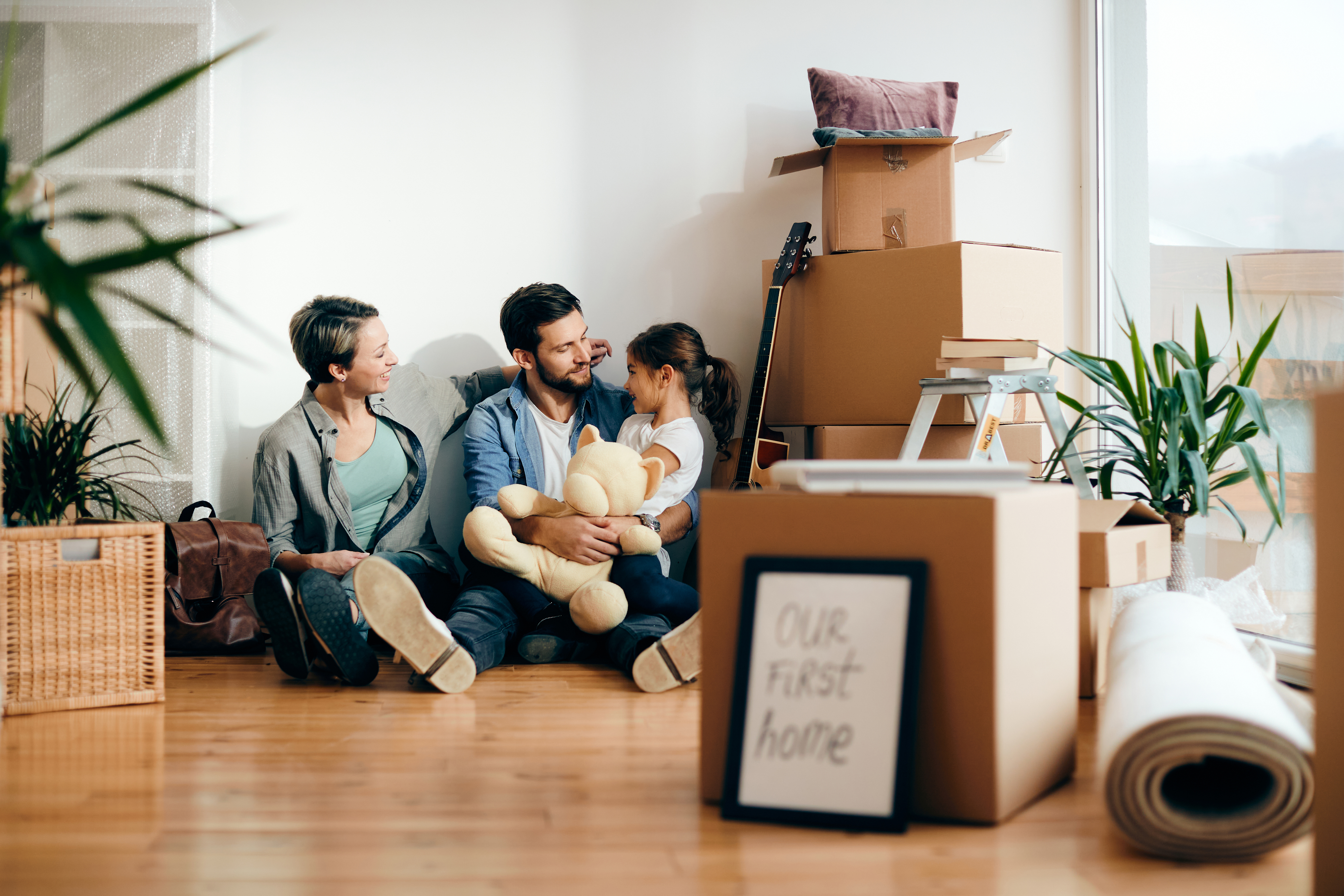 Family unpacking in a new home