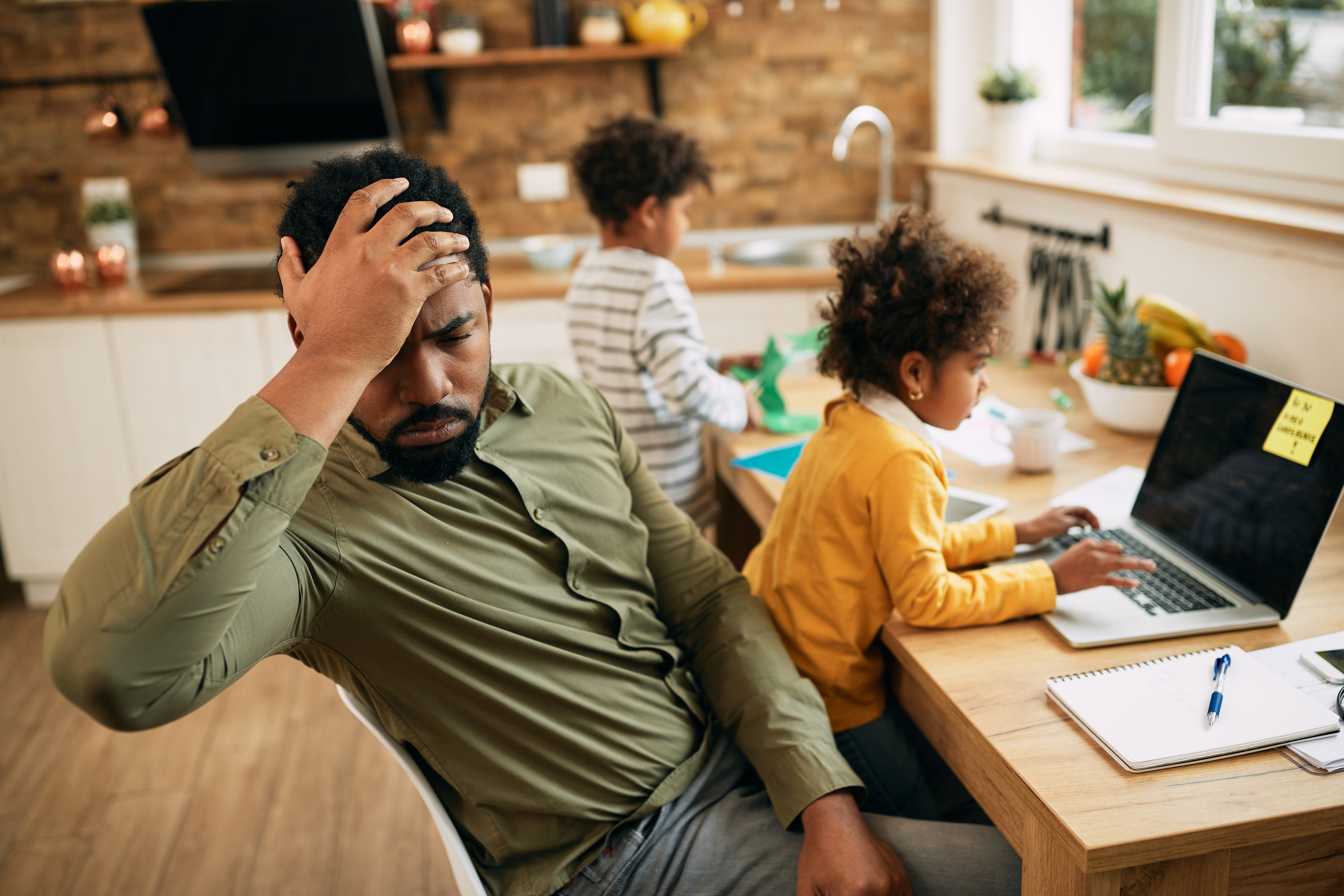 Parent and child planning at a kitchen table